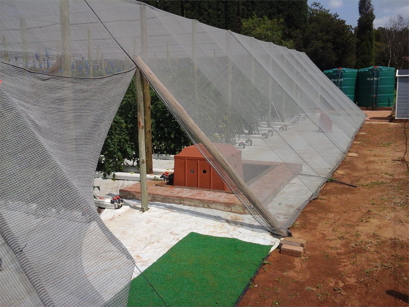 Protected hydroponic growing structure